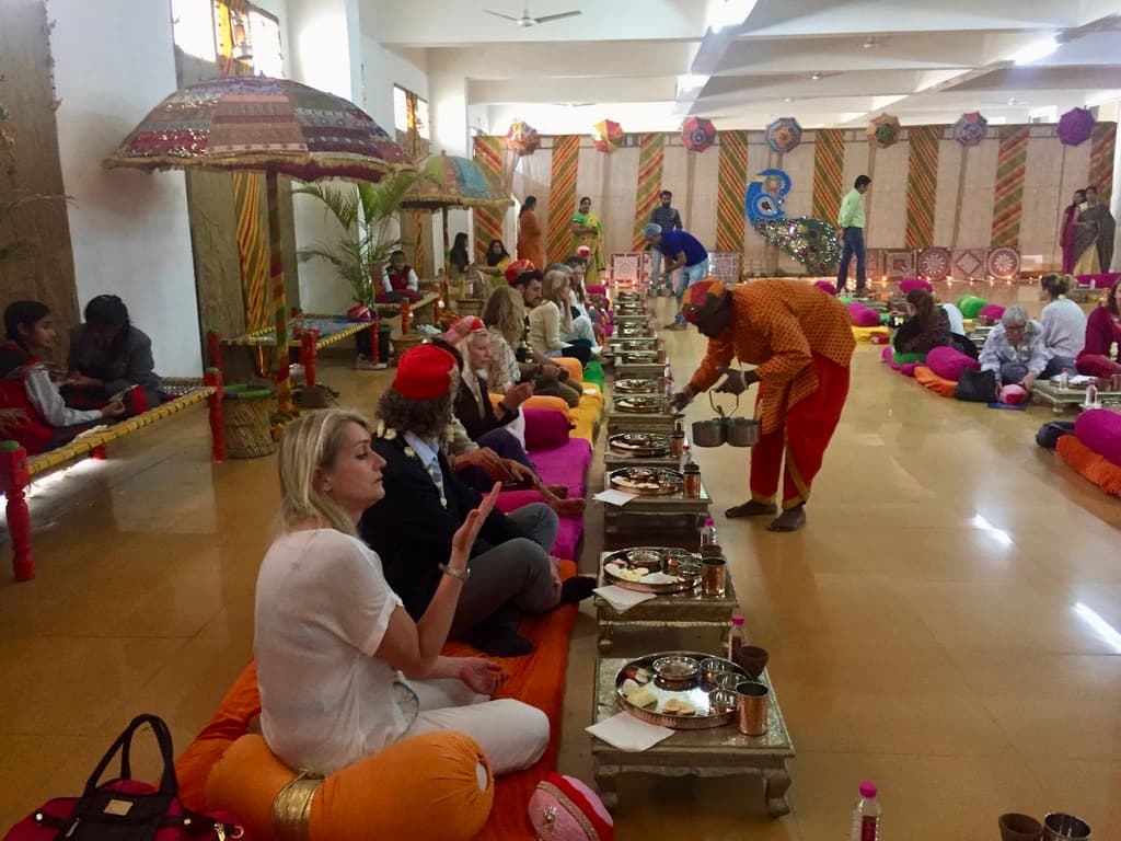 Kamlendra Singh Ranawat speaking with international travellers